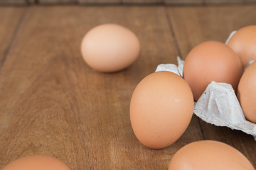 Fresh rural eggs on a wooden board