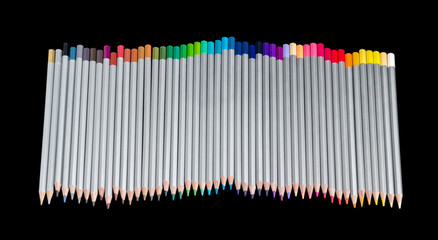 Set of colored pencils on a dark background