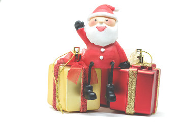Santa Claus dolls and Christmas decorations box on white background