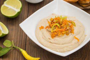 Hummus - mashed chickpeas appetizer, made up usually consists of olive oil, garlic, lemon juice, paprika, sesame paste.