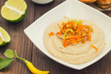 Hummus - mashed chickpeas appetizer, made up usually consists of olive oil, garlic, lemon juice, paprika, sesame paste.