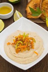 Hummus - mashed chickpeas appetizer, made up usually consists of olive oil, garlic, lemon juice, paprika, sesame paste.