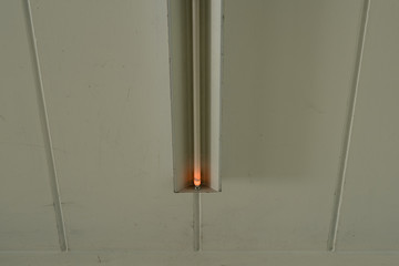 Fluorescent lamp at a whithe ceiling