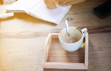 Close up of Cup of hot latte art coffee on wooden table.
