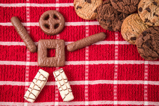 Pegman made from cookies. Cookies with chocolate on the towel background. Homemade pastries. Christmas time.