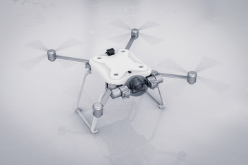 white drone with spinning propellers