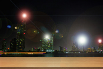 Perspective wood and Empty top wooden shelves of asian city of Bangkok , Thailand at night time