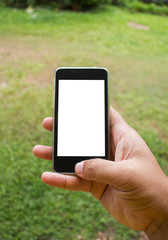 Soft focus of hand using mobile smart phone with blurred backgro