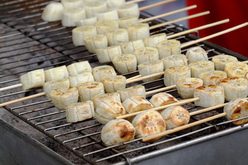 Banana skewers grilled in the market , Thai dessert.