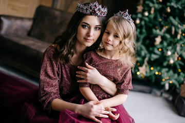 beautiful mother and her daughter in the image of the Queen and © MZaitsev