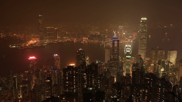 Aerial time lapse of Hong Kong Island skyline from Lugard Road Lookout from Victoria Peak mountain.