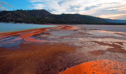 The Grand Prismatic Spring at sunset in the Midway Geyser Basin along the Firehole River in Yellowstone National Park in Wyoming North America