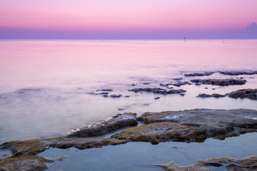 Fototapeta premium Early morning, pink sunrise over the sea