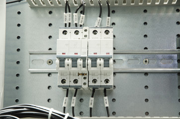 Close-up of electrical fusebox. Depth of field on the central switch