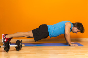 Athletic middle age man doing push-ups