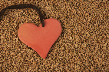 Red heart on cork background