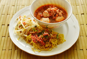 Chinese yellow noodle and spicy pork ball with dried shrimp soup