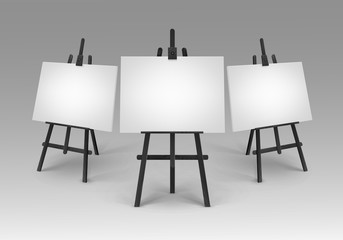 Set of Black Wooden Easels with Mock Up Empty Blank Canvases Isolated on Background