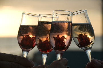 Bubbly wine in glasses with ornamental flowers