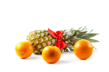 Ripe fresh pineapple and orange isolated on white background