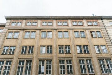 Fototapeta na wymiar old fashioned office building with orange facade