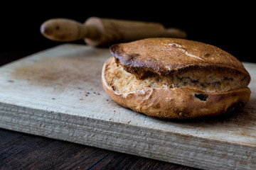 Ciabatta Bread with rolling pin on wooden surface