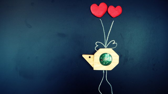 snail compass was tie by red heart shape balloons with wire draw by white chalk on shiny blackboard. valentine/love navigation and travel symbol, vintage background with copy space - Powered by Adobe