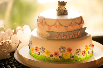 Delicious two storied birthday round cake for kid and baby for first year, vintage
