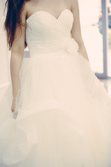 Bride white wedding dress, shallow focus, tulle cloth vertical, vintage