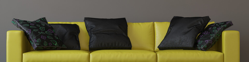 Gelbes Sofa mit schwarzen Kissen