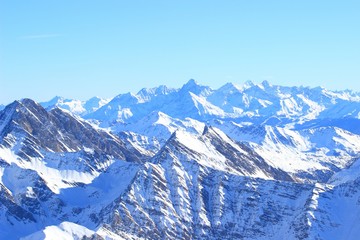 Fototapeta na wymiar Alpine peaks covered with snow. Aosta valley region in Italy.