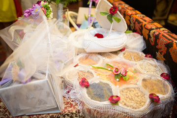 Naklejka na ściany i meble Sweets under abstract tulle cloth, shallow focus, sweets, gift
