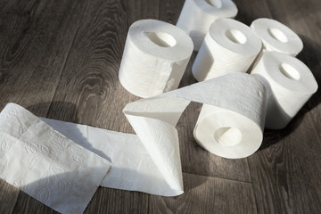 Toilet paper on wood background