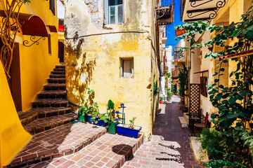 Authentic narrow colorful mediterranean street in Cretan town of Chania, island of Crete, Greece