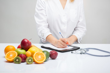 Healthy life style concept, doctor writing, diet and losing weight