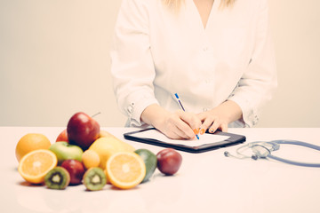 Healthy life style concept, doctor writing, diet and losing weight, vintage