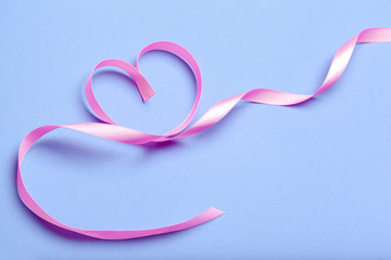 ribbon HIV, AIDS on blue background