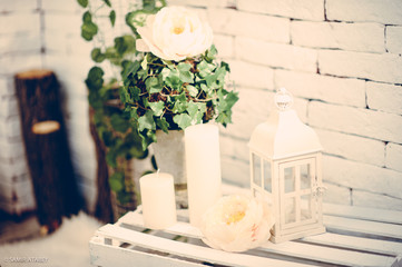 Decoration with white lantern and green, white flowers for wedding, vintage