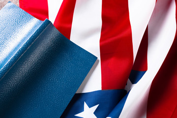 Bible laying on top of an american flag