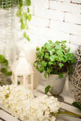 Decoration with white lantern and green, white flowers for wedding, vertical