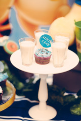 Sweets for candy bar for kid's birthday party, shallow focus, vertical vintage