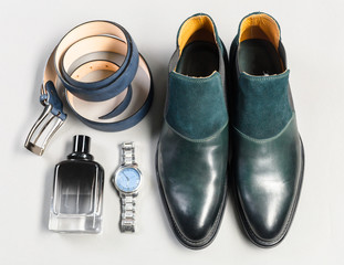 shoes and accessories for men lay on the wooden floor