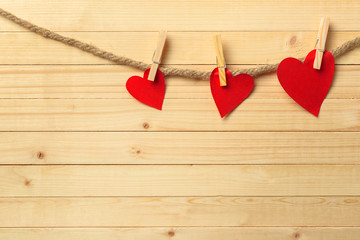 paper hearts pinned in line on twine rope