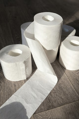 Toilet paper on wood background