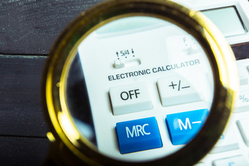 Calculator and magnifying glass