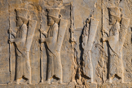 Carved relief of four Royal Persian Guards, facade of Private Palace of Darius the Great (Tachara), Persepolis, Iran