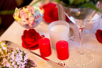 Decoration for wedding, new year, engagement, birthday days with red candle, rose flower