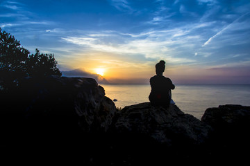 Silhouette of girl at sunrise