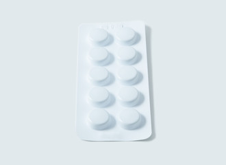 Aluminium blister pack of pills. The capsules are packaged in blisters, isolated on a white background. Disease. Flu. Medications.