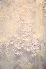 Detail of wedding dress , texture of the material for bride with flowers, vertical vintage